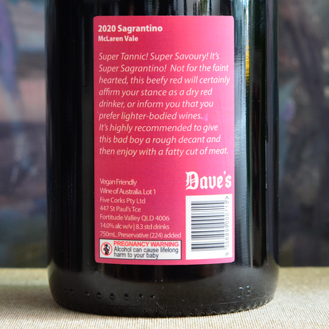 Close up of 2020 Sagrantino back label; Super tannic, super savoury - Super Sagrantino. Decanting recommended for this full-bodied dry red.