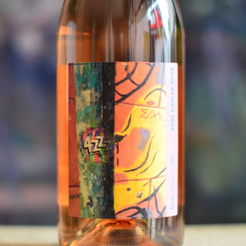 Close up of 4ZZZ Fundraiser 2025 Gerler Rosé front bottle artwork, of graffiti, telegraph pole and 4ZZZ logo