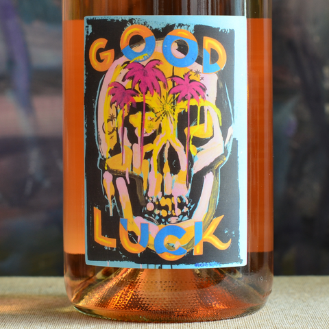 Front label close-up of special edition 2025 Gerler Rosé with label art by Lucks, with brightly coloured palm trees, and skull as a talisman honouring the cycle of life, resilience and fortune found in survival and transformation.